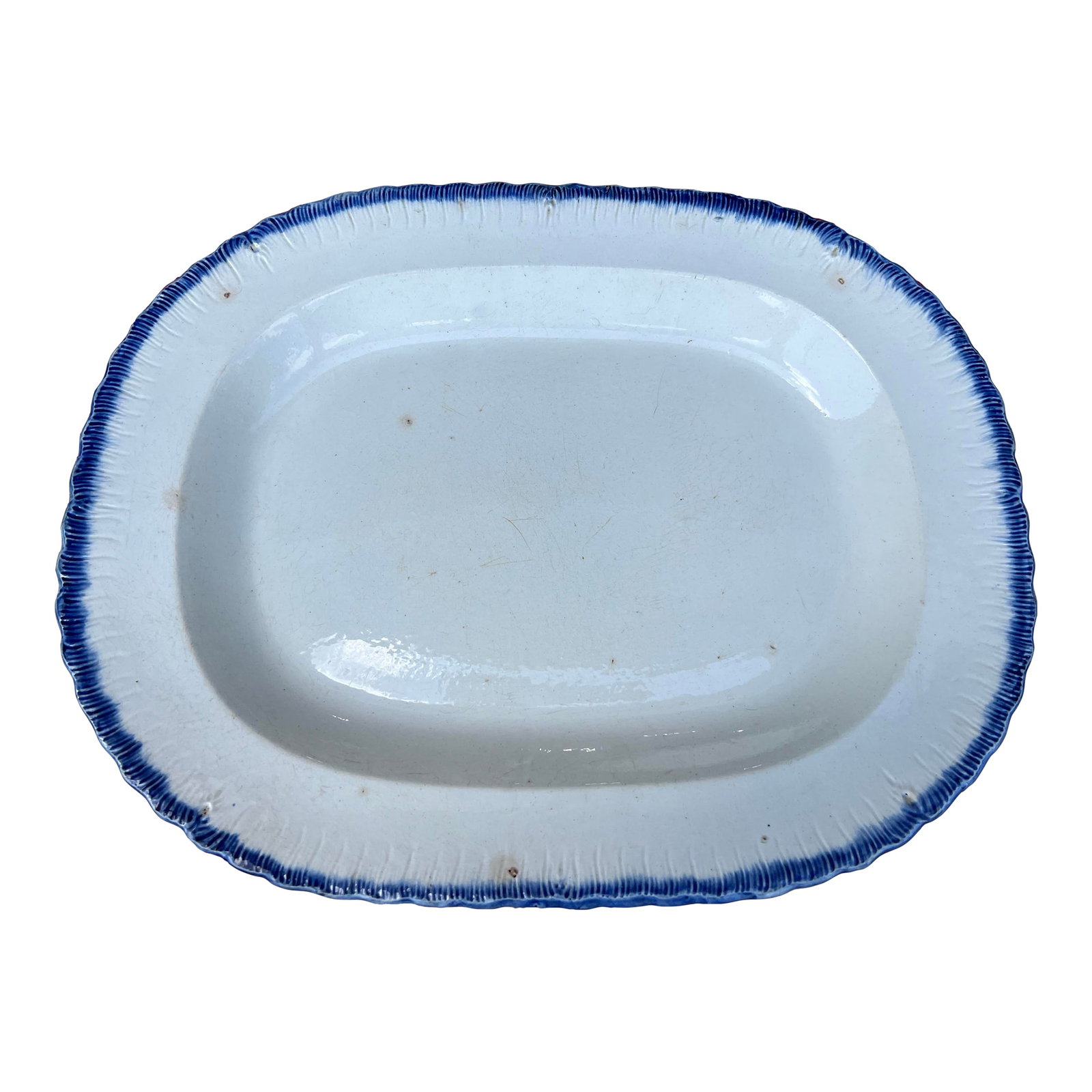 Antique Pearlware Blue Feather Edge Platter, Circa 1820's: Antique Pearlware Blue Feather Edge Platter, Circa 1820's Made in the Staffordshire district of England, circa 1810-1830 Blue glazed feather edge, with a pearlware clay body. Size: 17 3/4" by 14",