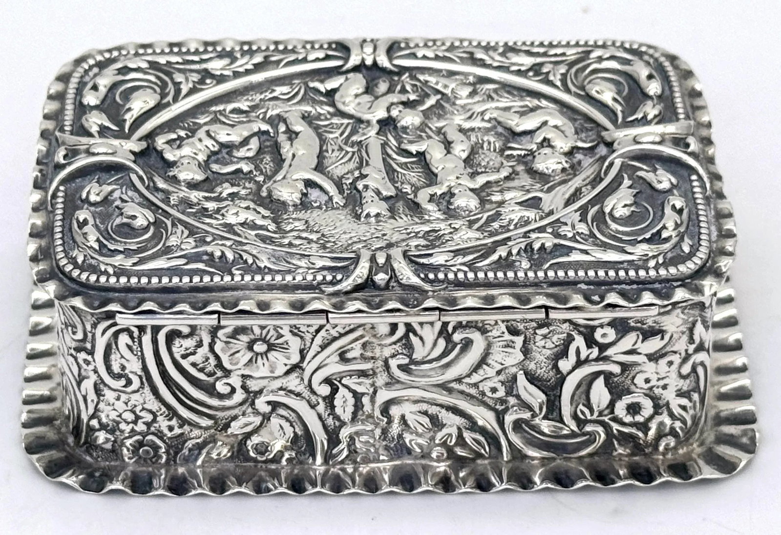 Victorian Sterling Silver Repoussé Trinket Box Putti Garden Scene, London, 1886 - 9
