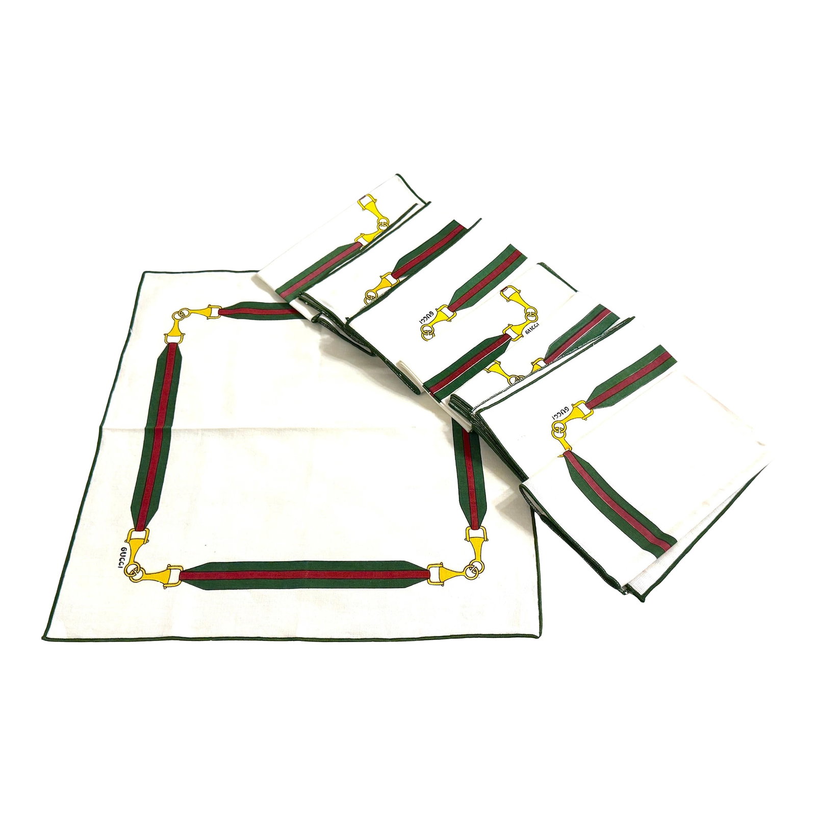 8 Vintage Aldo Gucci Equestrian Napkins with Horsebit Motif, Signed, 1980s: Set of Eight Vintage Gucci Equestrian Napkins with Horsebit Motif, Signed, with Original Storage Bag and Authenticity Card Italy, circa 1970s–1980s Dimensions: Each napkin measures 16" square.