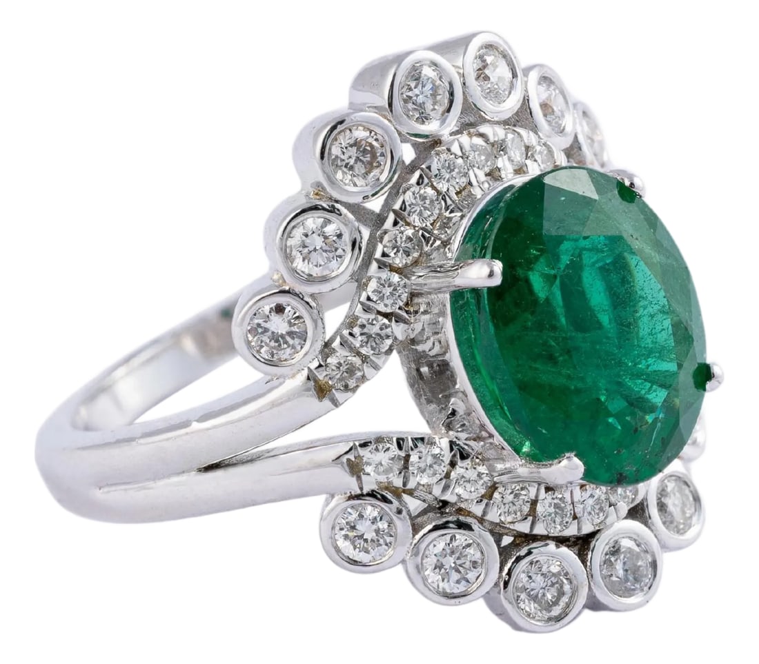 2.96 carats Natural Zambian Emerald Ring with Diamonds 0.65 carats and 14k Gold: This is an amazing everyday wear ring with high quality Zambian natural emerald and very good clarity diamonds which are vsi in clarity and G colour emeralds: 2.96 cts diamonds : 0.65 cts gold : 5.88
