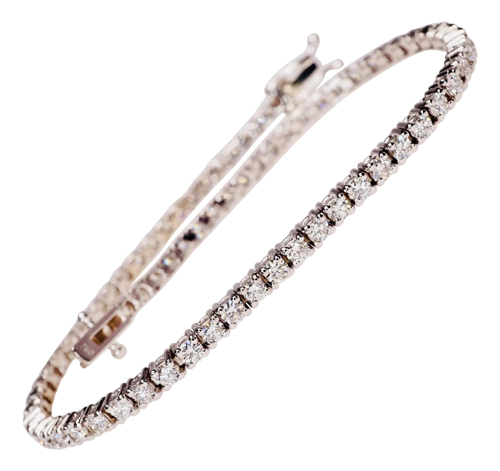 2.50 Carat Diamond Tennis Bracelet in 18K White Gold: Diamond Tennis Bracelet in 18K White Gold. Four prongs set natural brilliant round diamonds are E-F VS1-VS2. Carat weight: 2.50ct. The length: 7" inches. Total weight: 7.1 grams. Please allow for 3-4