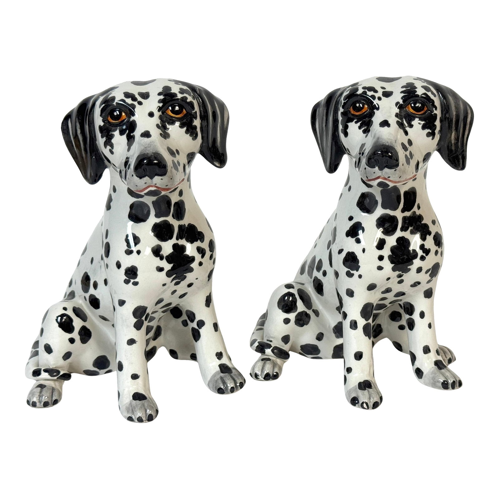 Pair of Italian Hollywood Regency Hand-Painted Pottery Dalmatian Puppies, 1970s: Pair of Italian Hollywood Regency Hand-Painted Pottery Dalmatian Puppies, Signed Italy, mid-20th century A charming pair of hand-painted Italian pottery Dalmatian puppies, each modeled seated with sou