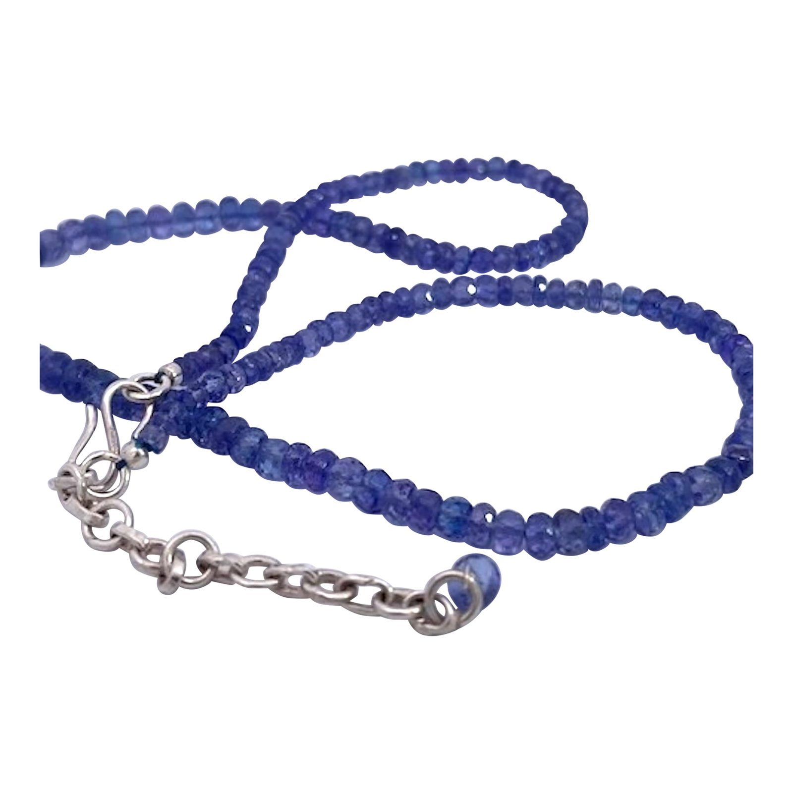 Tanzanite Beads on Chain Silver: These beads come out of the United Kingdom and the color is exceptional. These beads are on a silver chain with a bead drop in the back. These beads are 17" long and they weigh 18.49 grams each bead