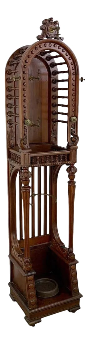 19th Century High Victorian Stick and Ball Variation Hall Rack: High Victorian stick and ball variation hall rack, attributed to Hunzinger. Rare form, tall and narrow with domed top fitted with brass hooks, the upper section measures 15" W x 16" D x 38" H. The