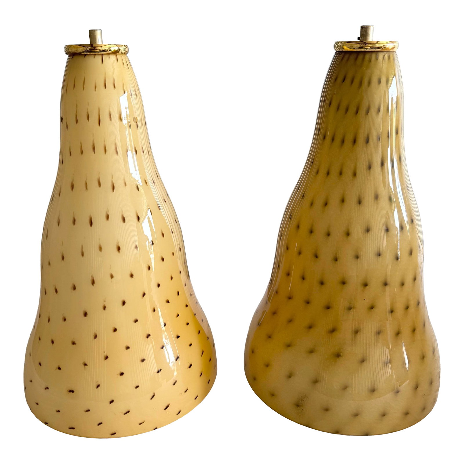Vintage Italian Glass Pendant Lamps by Toso & Massari for Leucos - A Pair: An elegant pair of Italian pendant lamps attributed to Toso & Massari for Leucos, exemplifying refined Murano glass craftsmanship. Each shade features a softly sculpted, tapering silhouette in warm am