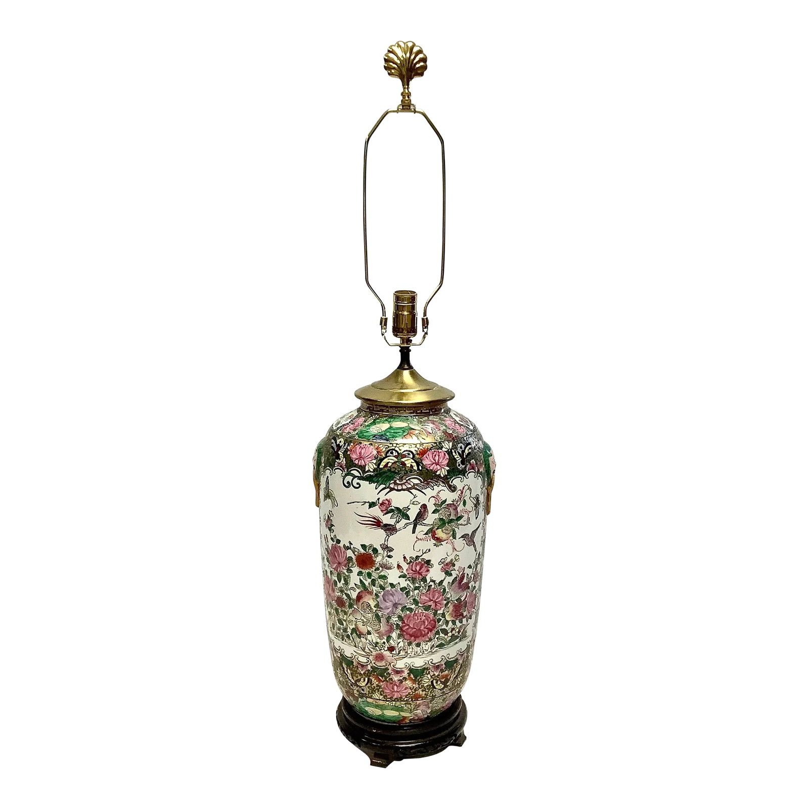 Large Chinese Porcelain Famille Rose Porcelain Lamp: Stunning large Famille Rose Chinese lamp on a wooden base. The colorful design on the body of the lamp is a large array of floral and birds with Chinese characters. Harp and Finial included. No