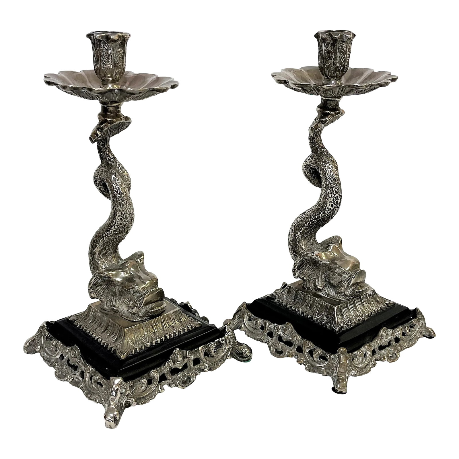 Vintage Silverplate Dolphin Candlesticks- a Pair: Magnificent pair of vintage silverplate dolphin candlesticks. These are very heavy and beautifully detailed depicting a dolphin with uplifted tail with the candle cup perched on top. Each sits on a