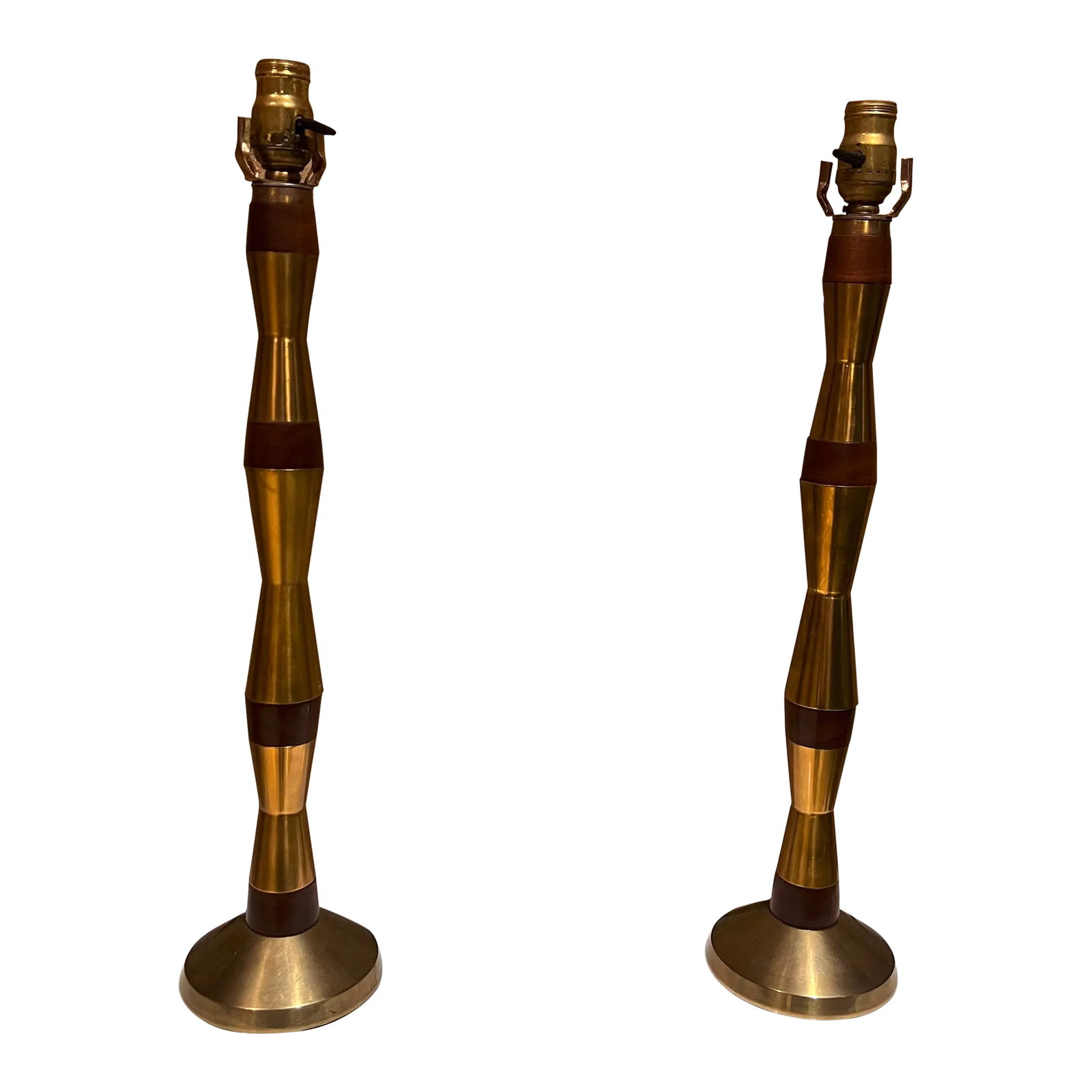 1960s Tall Table Lamps Solid Mahogany and Brass: AMBIANIC presents 1960s USA Tall Table Lamps sculpturally tapered in solid polished brass rings with mahogany wood inserts. Style of Tony Paul for Westwood Industries. Lamps are unmarked. Selling as a