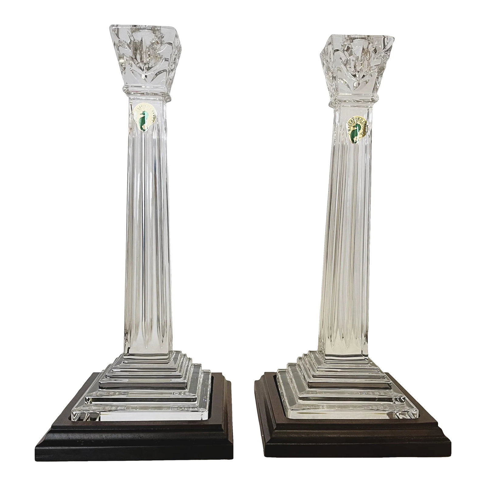 Waterford Crystal Candlesticks on Wood Plinths- a Pair: Pretty pair of tall Waterford Crystal candlesticks on wood plinths. These are like new with no wax residue. Each maintains the original Waterford labels. Each is etched with the Waterford name. A