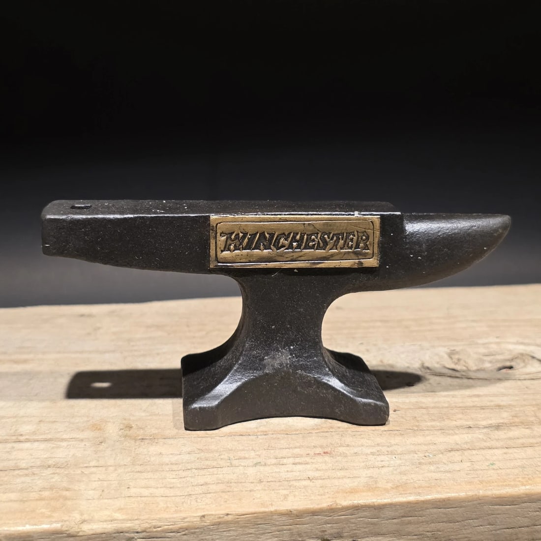 Cast Iron "Winchester" Miniature Anvil: 5 1/2" long x 2 1/2" Tall x 1 3/4" Wide A wonderful reproduction cast iron collectible advertising Winchester anvil. Advertising pieces like this many times were given to shops or used as sales