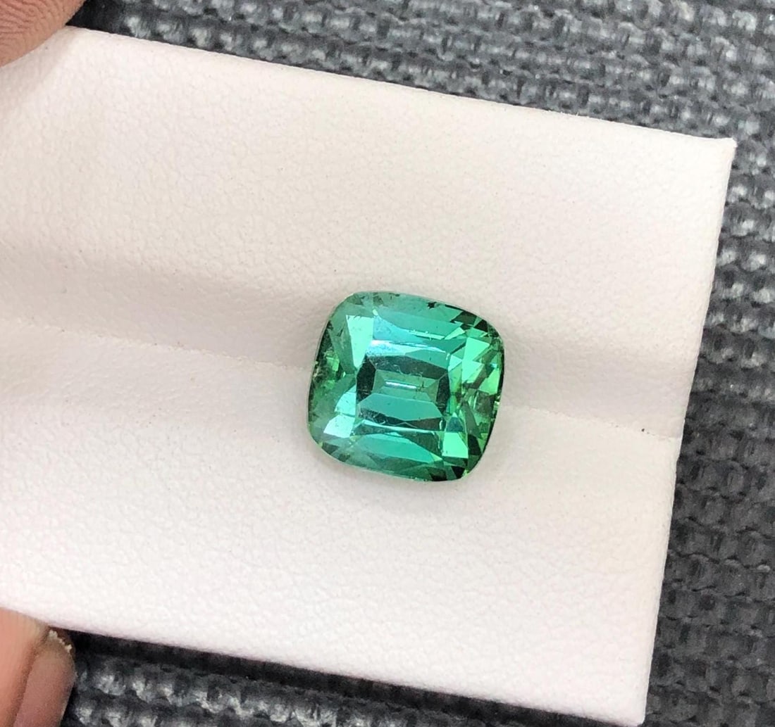 6.25 CT Faceted Blue Green Tourmaline Gemstone: October Birthstone: Weight : 6.25 Carats. Dimension : 10.3 X 9.8 X 8.3 MM Color: Blue Green Clarity : SI Luster: Vitreous Associated month: October Crystal system: Hexagonal crystal system Hardness (Mohs hardness