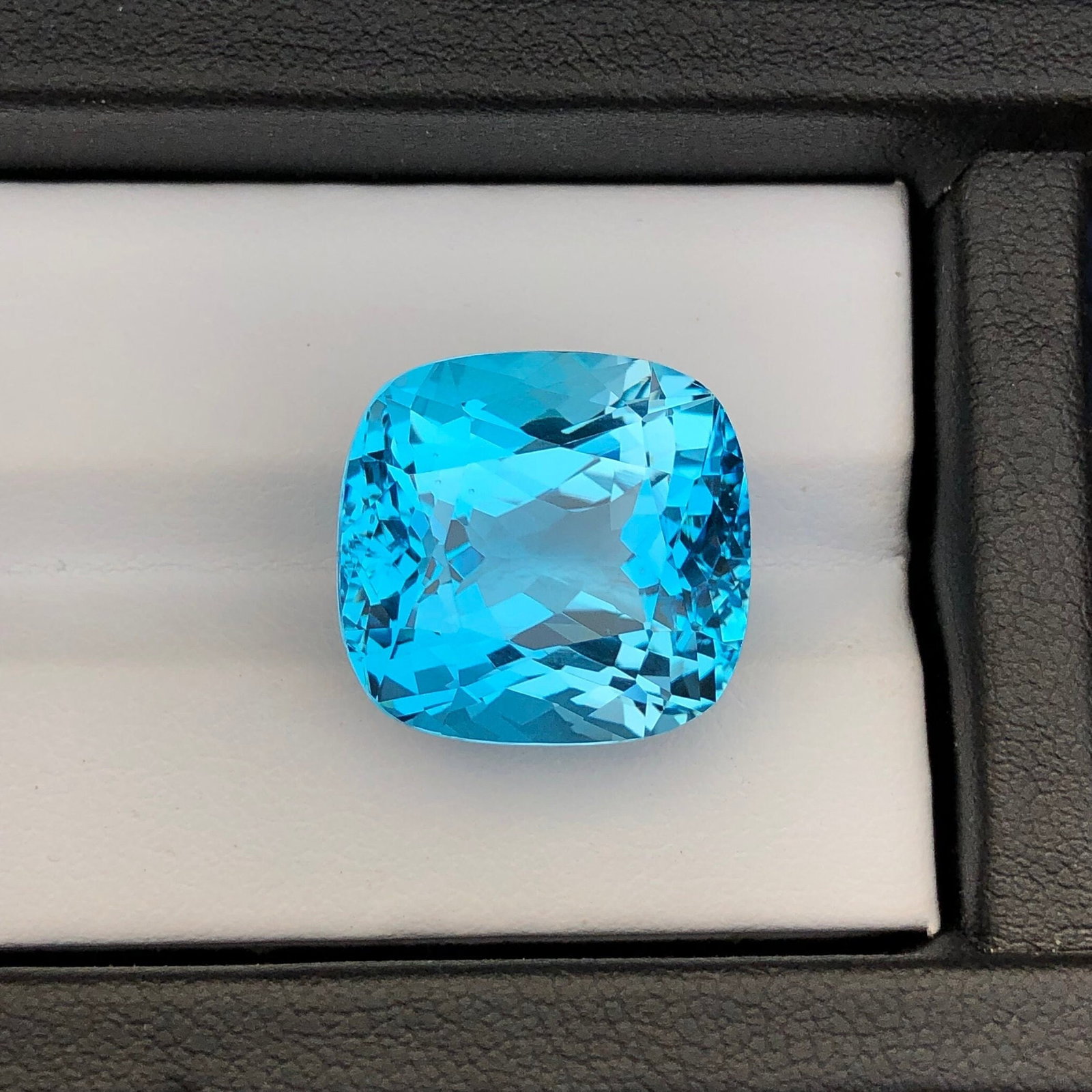 32.2 Carat Swiss Blue Topaz Gemstone: Cushion Cut December Birthstone: Introducing a magnificent Swiss Blue Topaz gemstone. Its long cushion shape, which sparkles wonderfully, stands for prosperity and love. This jewel is exquisitely carved and emanates grace and charm.