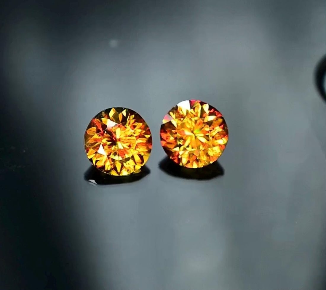 Sphene Gemstone Pair: 2.95 Carat Round Cut Titanite for Earrings: This stunning full fire sphene titanite loose gemstone features a captivating round cut that enhances its brilliance and beauty. With its vibrant play of colors and exceptional clarity, this gemstone
