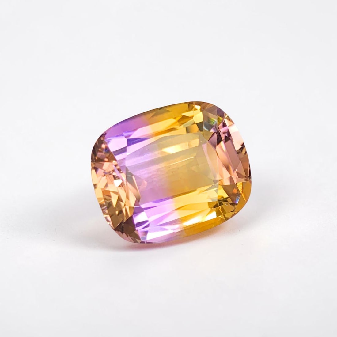 Natural Ametrine Gemstone, Bi Color Ametrine Loose Stone For Jewelry Making: Natural Ametrine Gemstone, Bi Color Ametrine Loose Stone For Jewelry Making Weight (CT) : 16.45 Measurements(MM) : 18 x 15 x 9 Shape : Cushion Color : Purple Yellow Treatment : None Clarity : Eye