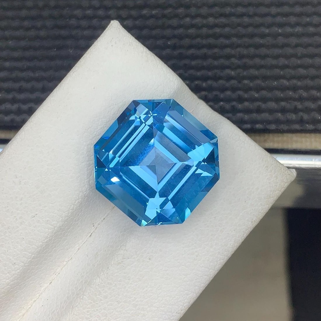 20.3 Carat Swiss Blue Topaz Gemstone: Asscher Cut, Jewelry Size: Gemology: * Weight : 20.300 carat * Dimension : 17*17&11 mm * Colour: Blue * Clarity : Loupe Clean * Shape : Asscher Cut * Hardness : 8 * Zodiac Sign : Scorpio * Luster: Vitreous * Associated Month :