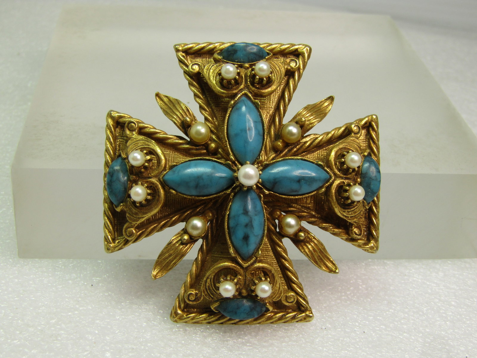 Vintage Florenza Maltese Cross Brooch, Faux Turquoise/Pearl, 1950's-1960's: Vintage Florenza Maltese Cross Brooch, Faux Turquoise/Pearl, 1950's-1960's. This is gold tone with twisted frame, textured background raised scrolled with a textured finish and curved leaves between