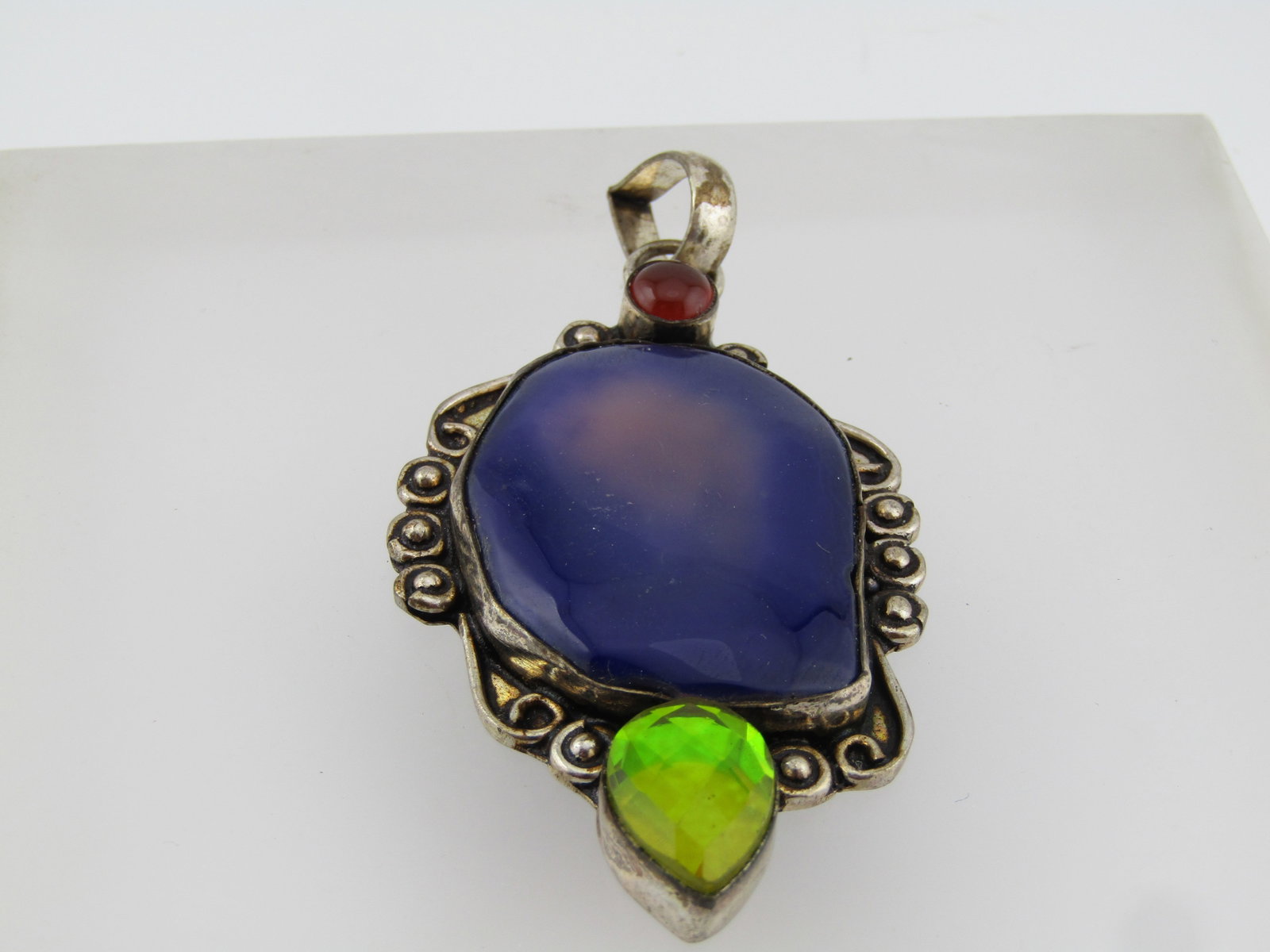 Silver Plated Glass and Stone Pendant - Chunky/Southwestern Vibe, 1980's-1990's: Silver Plated Glass and Stone Pendant - Chunky/Southwestern Vibe, 1980's-1990's. This is appx. 3" by 1.5" with bezel-set honeycomb faceted iridescent green pear-shaped s tone on the bottom and a