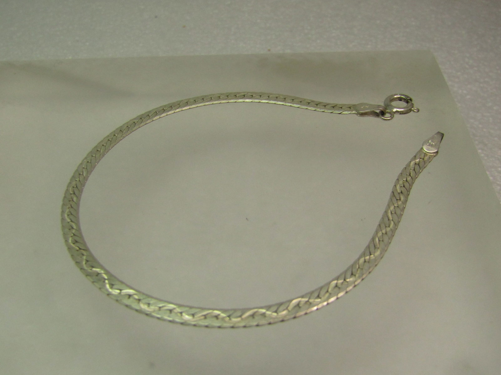 Vintage Sterling Herringbone Bracelet, 7", 3mm, Zig-Zag Accent, 1980's, Signed: Vintage Sterling Herringbone Bracelet, 7", 3mm, Zig-Zag Accent, 1980's, Signed ALF. This has a spring ring clasp. It is marked Italy and .925 and tests as sterling with an appx. weight of 2.58 grams.