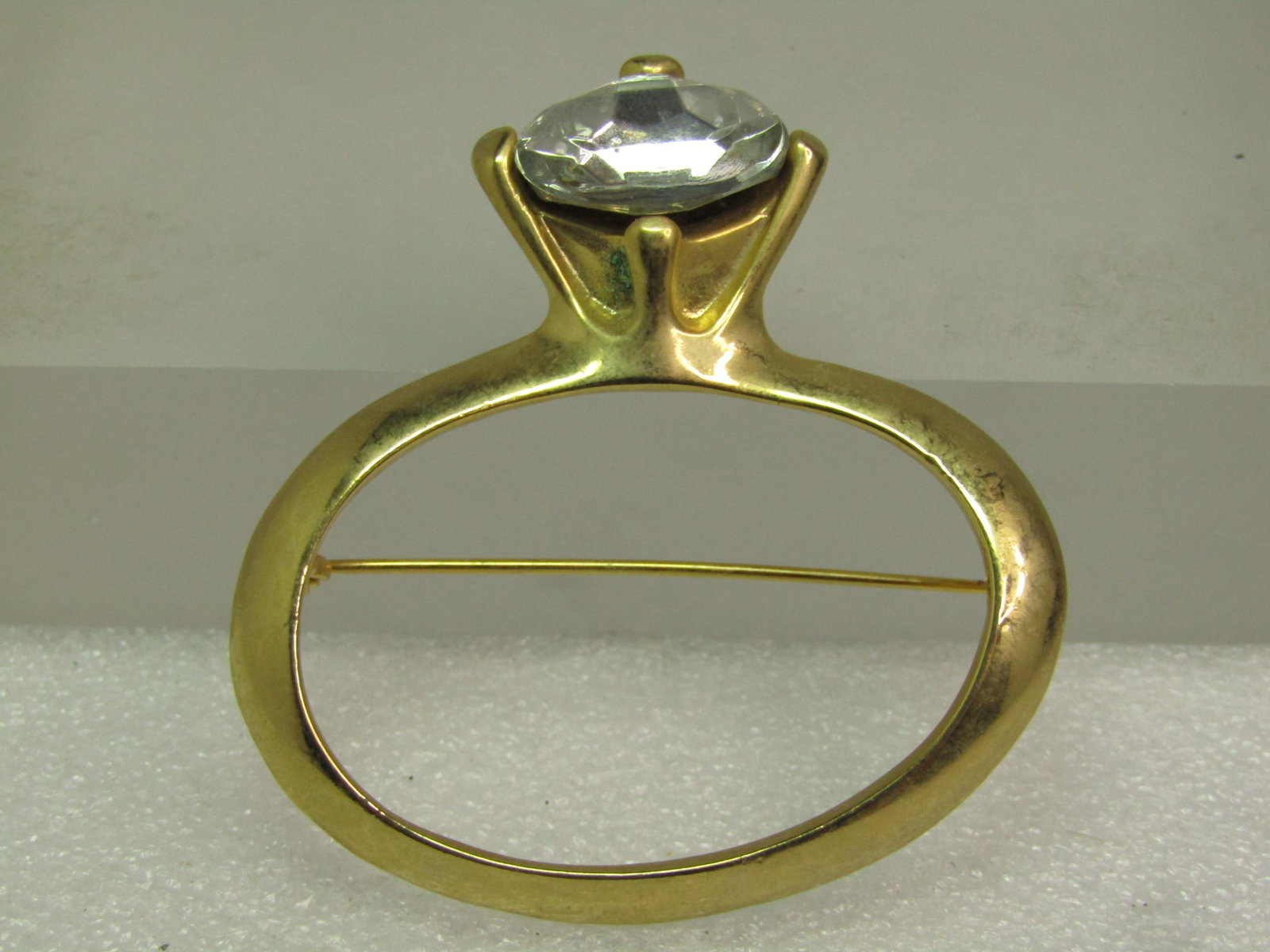 Vintage Engagement Ring Brooch Clear Stone, 1980's: Vintage Engagement Ring Brooch Clear Stone, 1980's Large, at 2.25" tall and 2" wide. The rhinestone is clear acrylic stone that is appx.17.5mm wide and 12mm tall. It is not signed or marked. Blemis