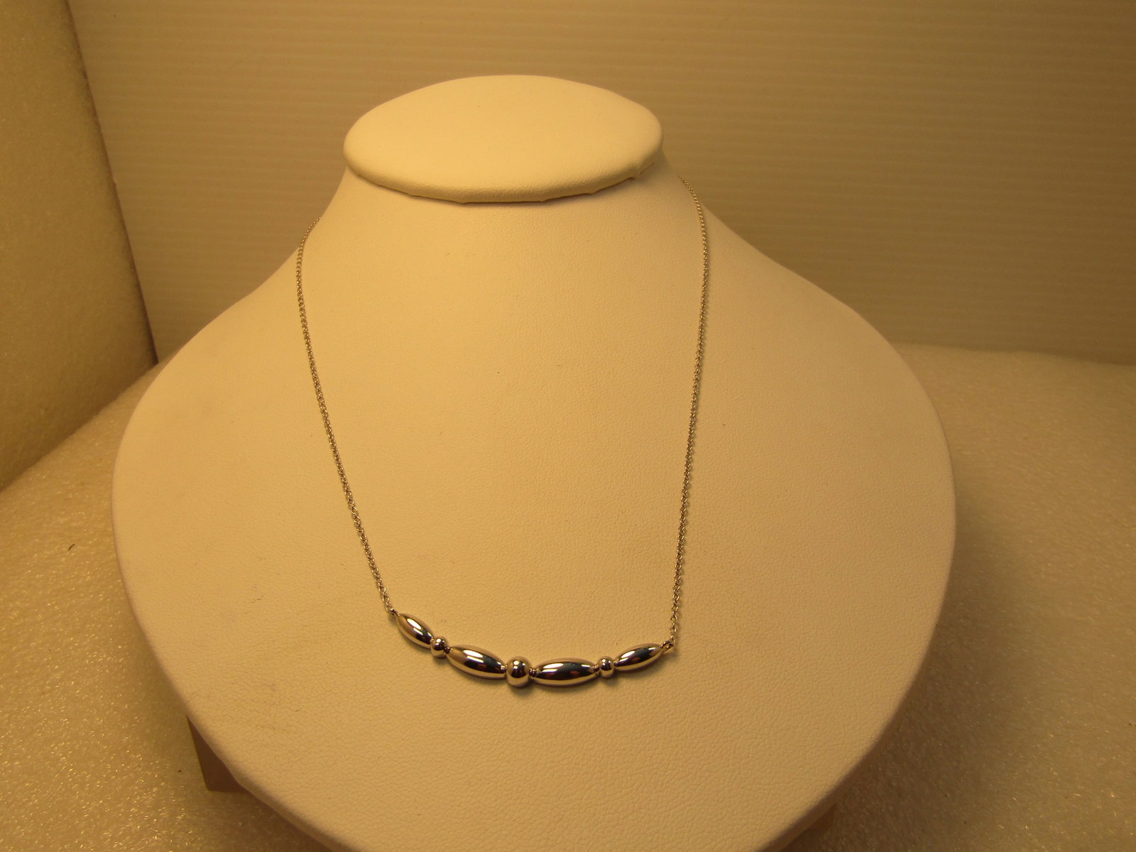 Sterling Silver Curved Bar Necklace, Gabriel and Co., 1990's or After, 17.5": Sterling Silver Curved Necklace, Gabriel and Co., 1990's or After, 17.5". This has a curved drop at front with elongated pointed beadlike design with beadlike accents between the elongated beads. The 