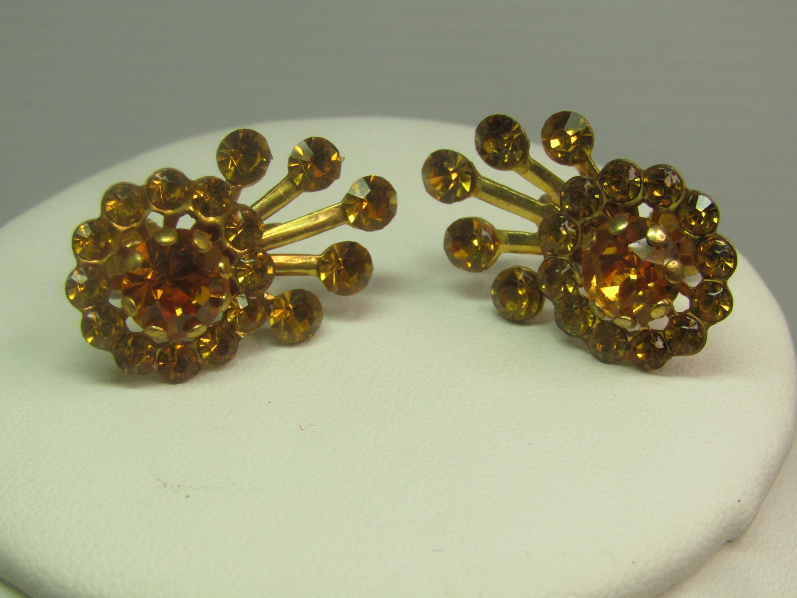Vintage Golden Rhinestone Comet/Ray Screwback Earrings, 1940's-1960's: Vintage Golden Rhinestone Comet/Ray Screwback Earrings, 1940's-1960's. These are gold tone with a blossom halo golden glass rhinestone top - or a commet - with a large, appx. 8mm round stne set rapise