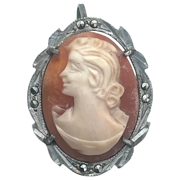 Vintage Silver and Marcasite Shell Cameo Pendant/Brooch: Title: Vintage Silver and Marcasite Shell Cameo Pendant/Brooch Description: Vintage Silver and Marcasite Shell Cameo Pendant/Brooch Hallmarked: 800 Weighs: 3 grams Measures Approx: 1 x .75 inches Date