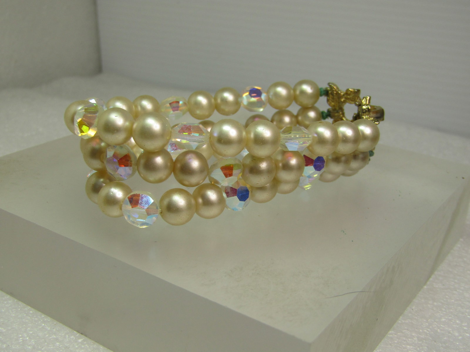 Vintage Triple Strand Faux Pearl Bracelet, AB Glass Beads, Signed Marvella. 1960's: Vintage Triple Strand Faux Pearl Bracelet, AB Glass Beads, Signed Marvella. 1960's. It is appx.7.5" long. The faux pearls are appx. 7.5mm round and the aurora borealis beads are appx. 7mm by 7.3mm.