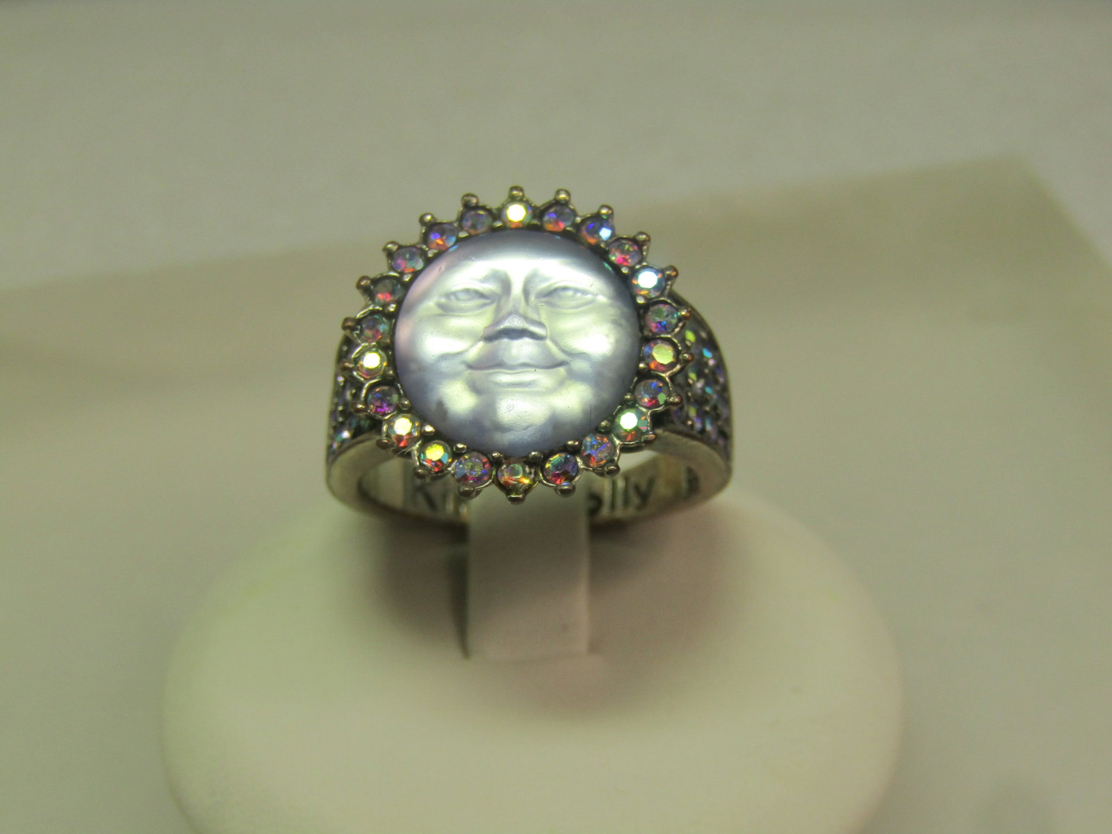AB Rhinestone Blue Moonface Ring, Sz. 7.5, 1990's, Signed: AB Rhinestone Blue Moonface Ring, Sz. 7.5, 1990's, Signed Kirk's Folly - but it is not Kirk's Folly in my belief. It's very pretty with the blue/purple aurora borealis rhinestones shimmer around the s
