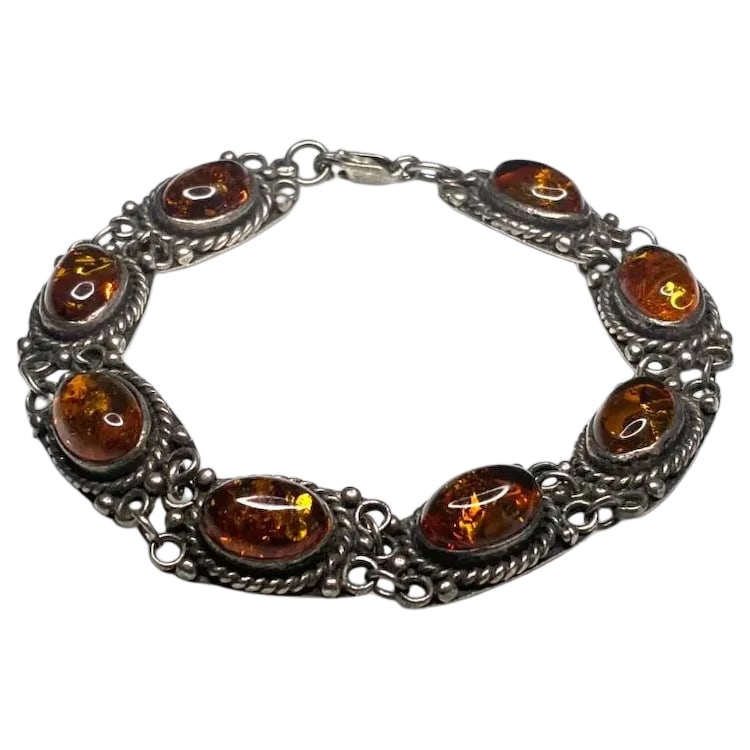 Vintage Baltic Amber Sterling Silver Bracelet with Safety Chain: Title: Vintage Baltic Amber Sterling Silver Bracelet with Safety Chain Description: Vintage Baltic Amber Sterling Silver Bracelet with Safety Chain Hallmarked: 925 Weighs: 26 grams Measures: 8.5