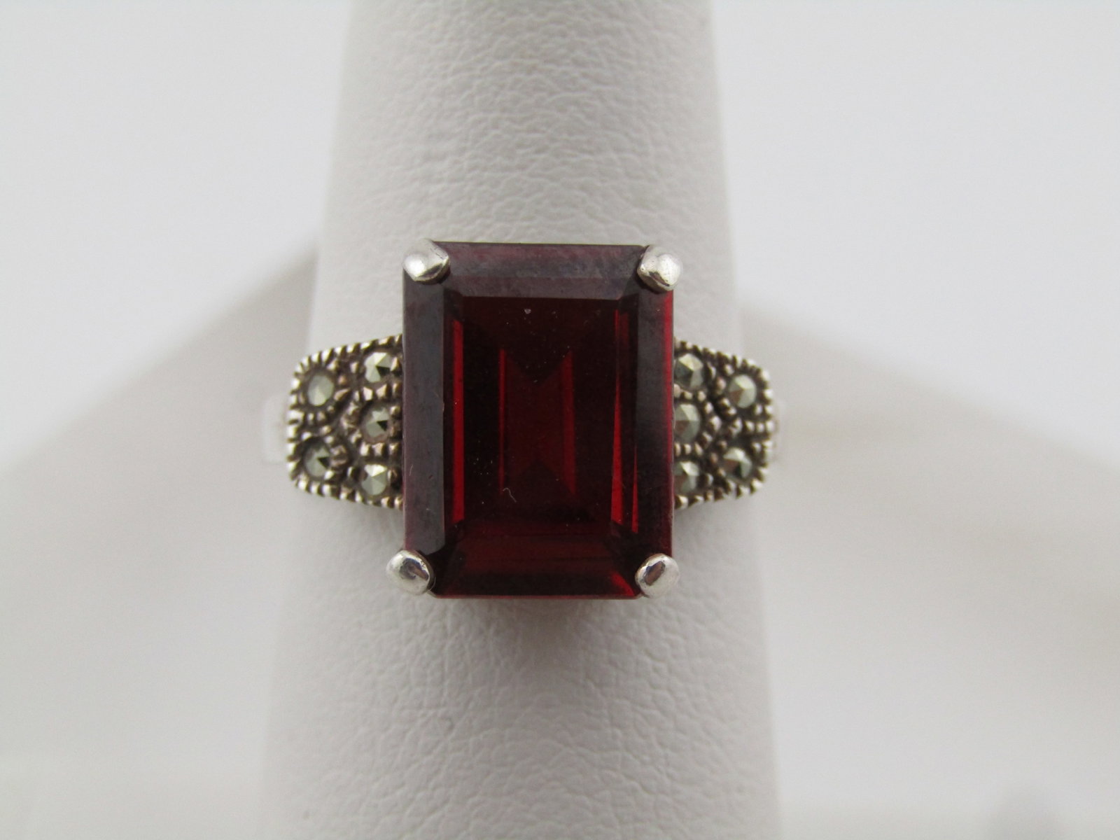 Vintage Sterling Rectangular Red Stone, Faux Marcasite Ring, Sz. 6.5, 1980's: Vintage Sterling Rectangular Red Stone, Faux Marcasite Ring, Sz. 6.5, 1980's. The stone is set with prongs at the corners. It is appx. 11.5mm by 9mm. It has a drop down from the stone at band level, o