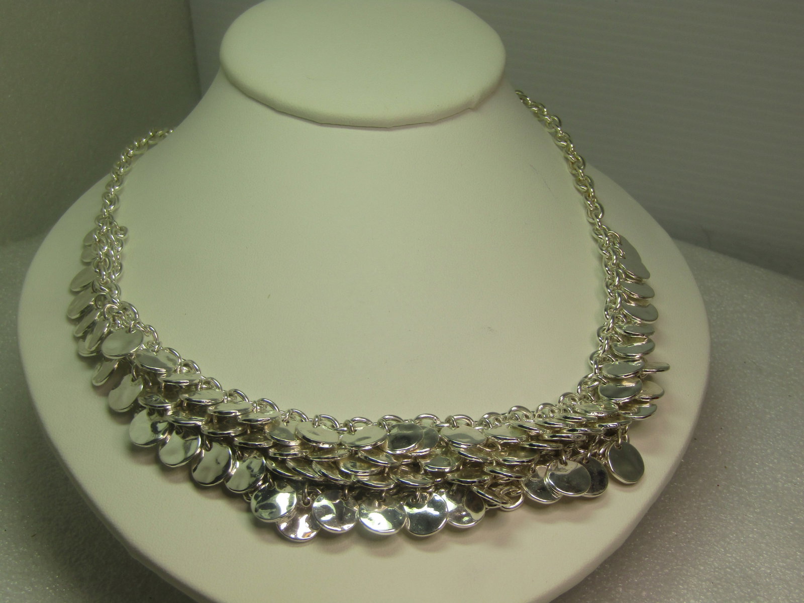 Silver Tone Hammered Disc Bib Necklace, Chainmain Style, 21", 1990's: Silver Tone Hammered Disc Bib Necklace, Chainmain Style, 21", 1990's or after. This has a chain mail style front with four staggered rows of hammered silver tone discs that are appx.9mm round. The