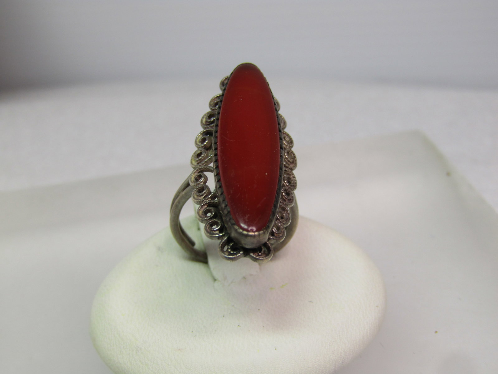 Vintage Sterling Carnelian Colored Ring, Sz.4-6, 1950's-1960's: Vintage Sterling Carnelian Colored Ring, Sz.4-6, 1950's-1960's. Southwestern vibe. This is a long ring at appx. 1.25" long and slightly over 1/2" wide. It has a raised stone that is the color of