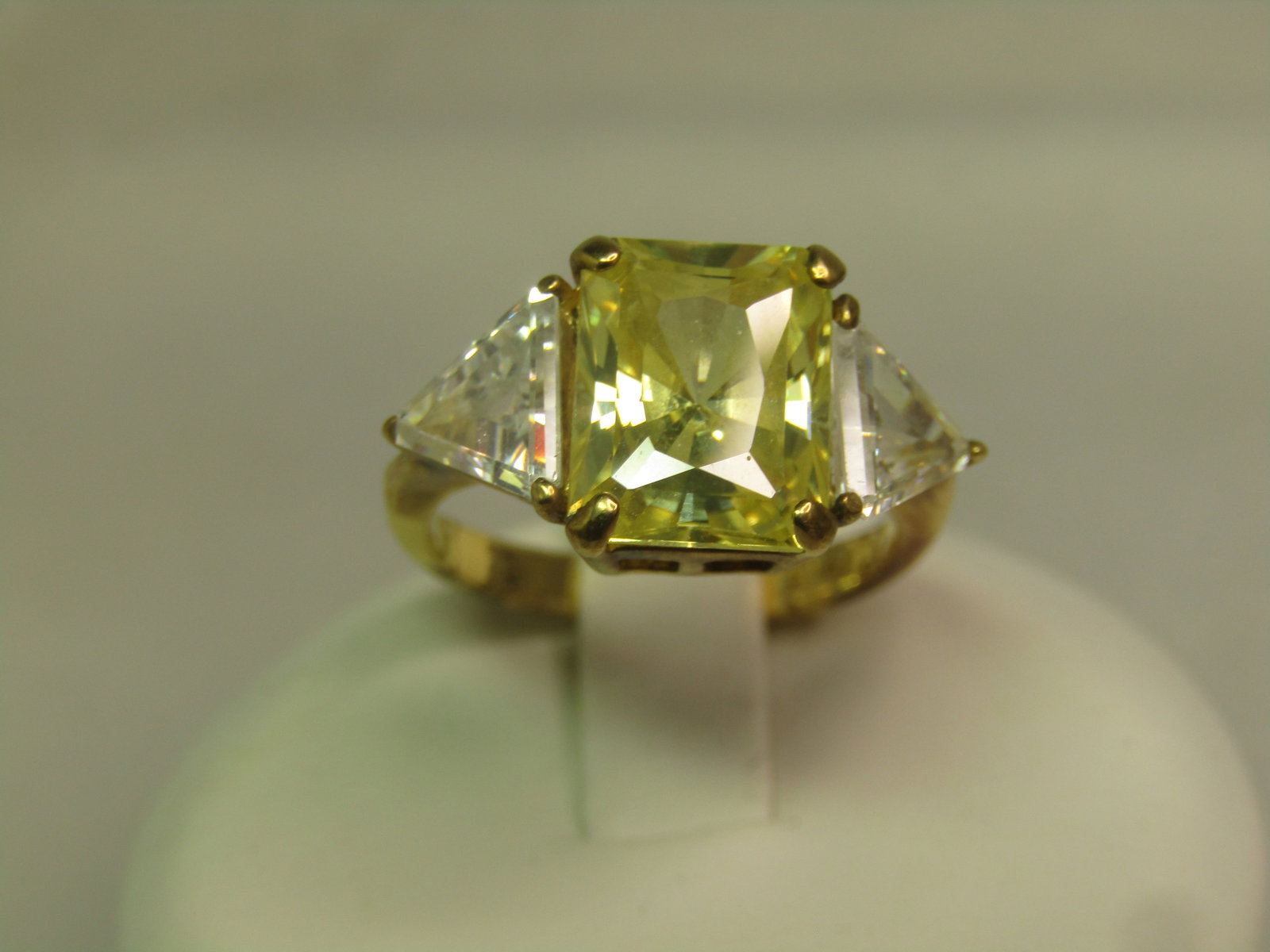 Vintage Yellow and Clear CZ Ring, Sz. 4.5, Signed Aviv, 1980's-1990's: Vintage Yellow and Clear CZ Ring, Sz. 4.5, Signed Aviv, 1980's-1990's . This is marked .925 with a gold plating. It has magnetic reaction so it may not be sterling. The center stone is appx. 9.5mm by 