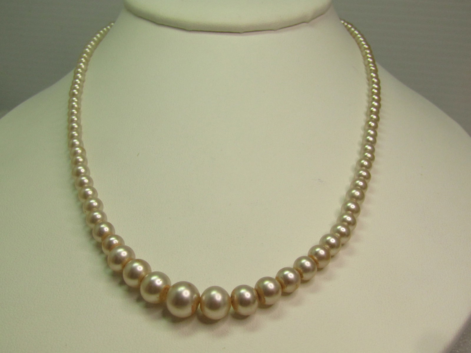 Vintage Graduated Cultured Pearl Necklace, Sterling Clasp 17", 1940's-1960's: Vintage Graduated Cultured Pearl Necklace, Sterling Clasp 17", 1940's-1960's. The pearls are appx. 3mm to 8mm. The clasp is a filgiree cat-eye shaped clasp marked silver and tests as sterling .It is n