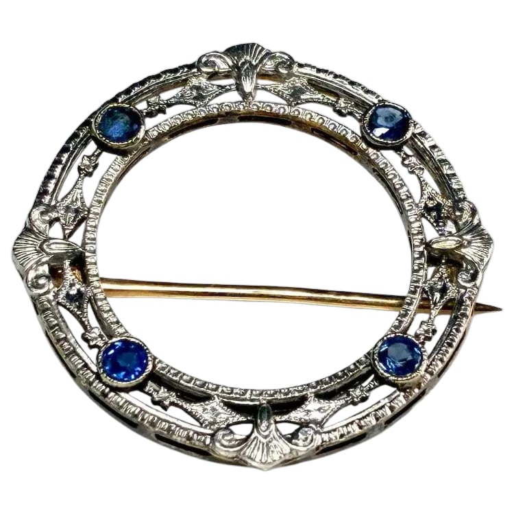 Antique 14k White Gold Art Deco Sapphire Brooch: Title: Antique 14k White Gold Art Deco Sapphire Brooch Description: Antique 14k White Gold Art Deco Sapphire Brooch Hallmarked: 14k white gold front/yellow gold back Weighs: 1.4 grams Measures: 1 x 1 