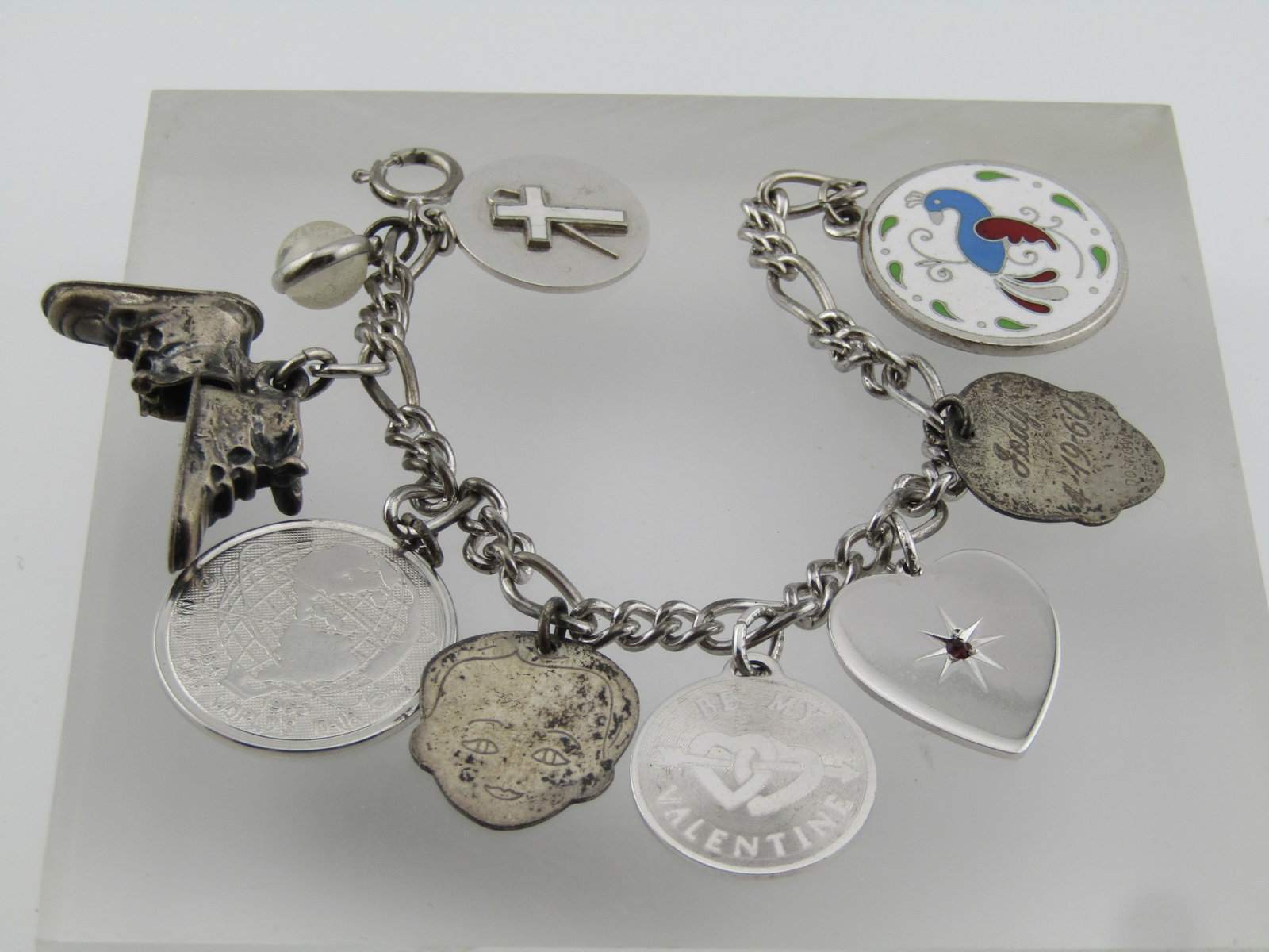 Vintage Sterling Charm Bracelet, 1950's-1990's, 7", Ten Charms.: Vintage Sterling Charm Bracelet, 1950's-1990's, 7". This has 10 charms. Four are sterling and the others are likely not. It is a rounded figaro link bracelet that is marked sterling. It is7". Total we