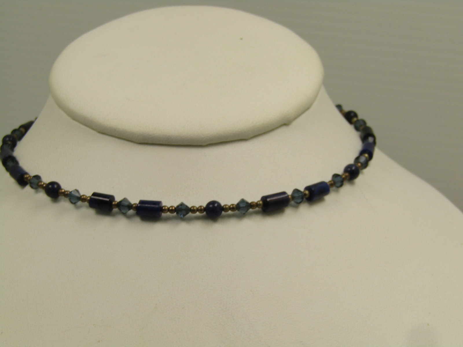 Silpada Sterling Lapis Lazula Choker Necklace, Coiled. 15.5", 1990's: Silpada Sterling Lapis Lazula Choker Necklace, Coiled. 15.5", 1990's. This easily opens to adjust to slip on most necks. it has the Silpada hang tag. Tubular and round lapis lazuli beads with blue