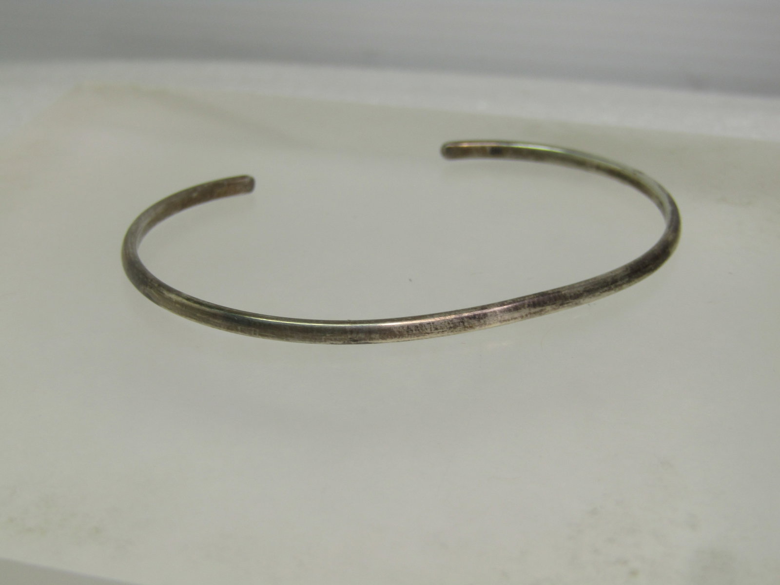 Vintage Sterling Cuff Bracelet, 2.5mm, 1967, 4.83 grams, 6.25": Vintage Sterling Cuff Bracelet, 2.5mm, 1967, 4.83 grams, 6.25". Great bracelet for youth or those with slender wrists. It has an opening of appx. 2.5mm side-to-side and 1.5" from front-to-back. It