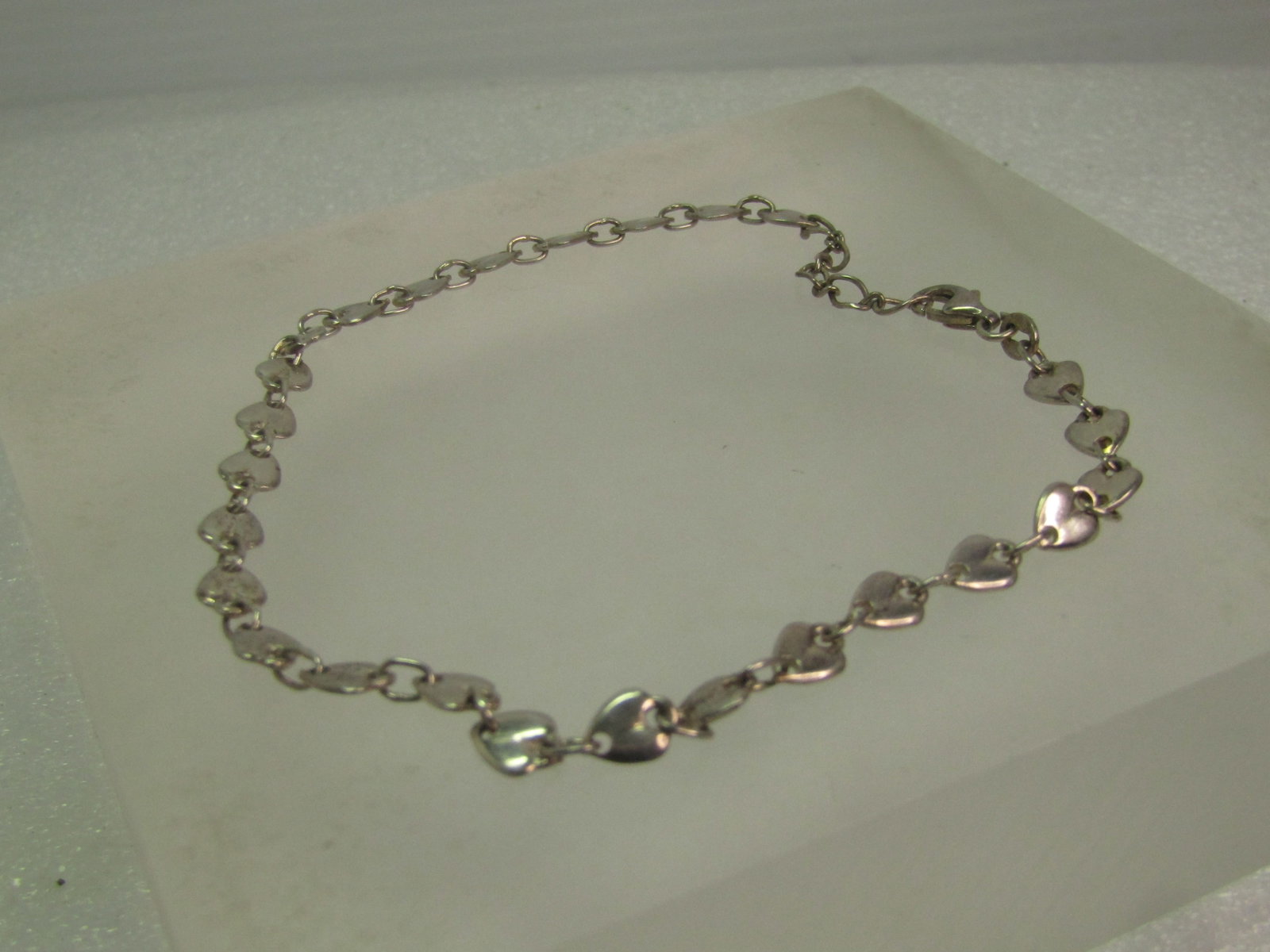 Vintage Sterling Heart Link Ankle Bracelet, 10" 1980's-1990's: Vintage Sterling Heart Link Ankle Bracelet, 10" 1980's-1990's. This is appx. 5mm wide at the widest point of the heart and each heart is connected with an oval connector link. 9" are the heart links