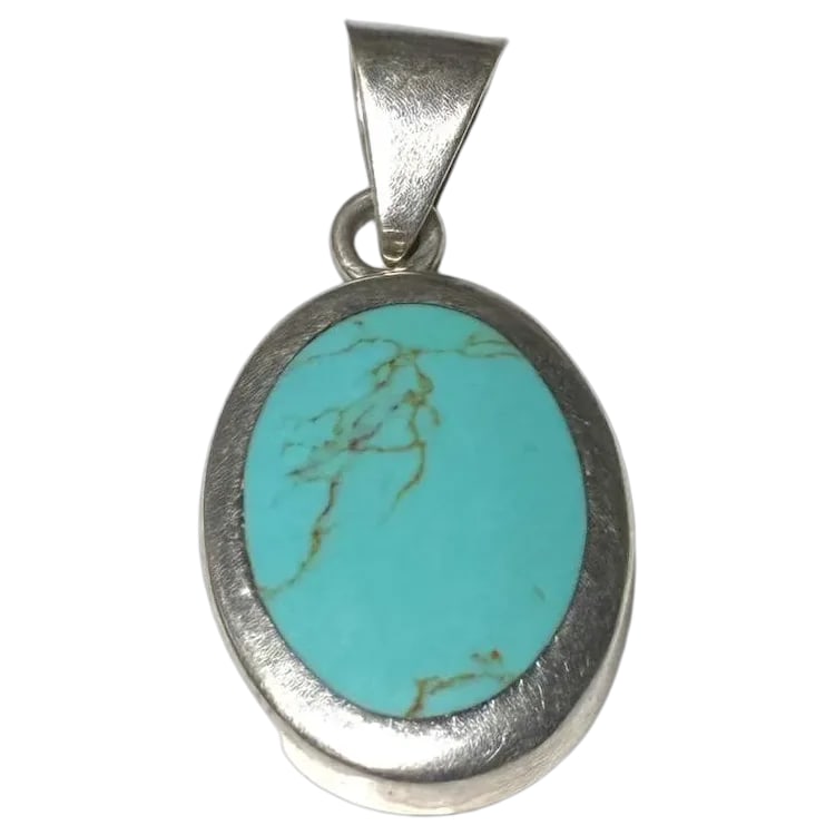 Vintage Sterling Silver Turquoise Pendant: Title: Vintage Sterling Silver Turquoise Pendant Description: Vintage Sterling Silver Turquoise Pendant Hallmarked: Mexico 925 Weighs: 12 grams Measures: 2 x 1 inch Date/Period: Vintage Materials: