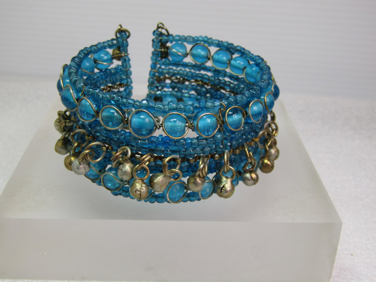 Vintage Aqua Glass Coiled Wrapped Bracelet, with Dangles, Bali/Mid-Eastern Style 6"-8",: Vintage Aqua Glass Coiled Wrapped Bracelet, with Dangles, Bali/Mid-Eastern Style 6"-8". 1960's-1970's. This will fit almost any wrist because it opens at the back and slips on easy and expands