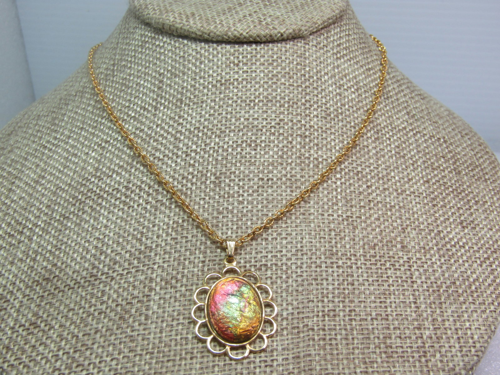 Vintage Faux Opal Shimmery Necklace, 18", 1970's: Vintage Faux Opal Shimmery Necklace, 18", 1970's. Gold tone with an open scalloped frame wider than the appx. 17mm by 12mm oval faux opal. 18" chain that is appx. 2mm wide with textured gold tone