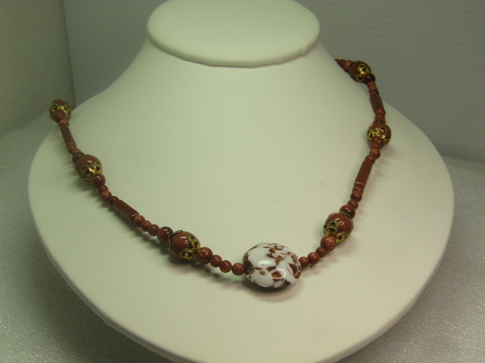 Vintage Gold stone and Coppery Glass Beaded Necklace, 20", 1980's-1990's: Vintage Gold stone and Coppery Glass Beaded Necklace, 20", 1980's-1990's. The goldstone beads are in a variety of round beads that range from 4mm to 9mm. There are also long rectangular goldtone