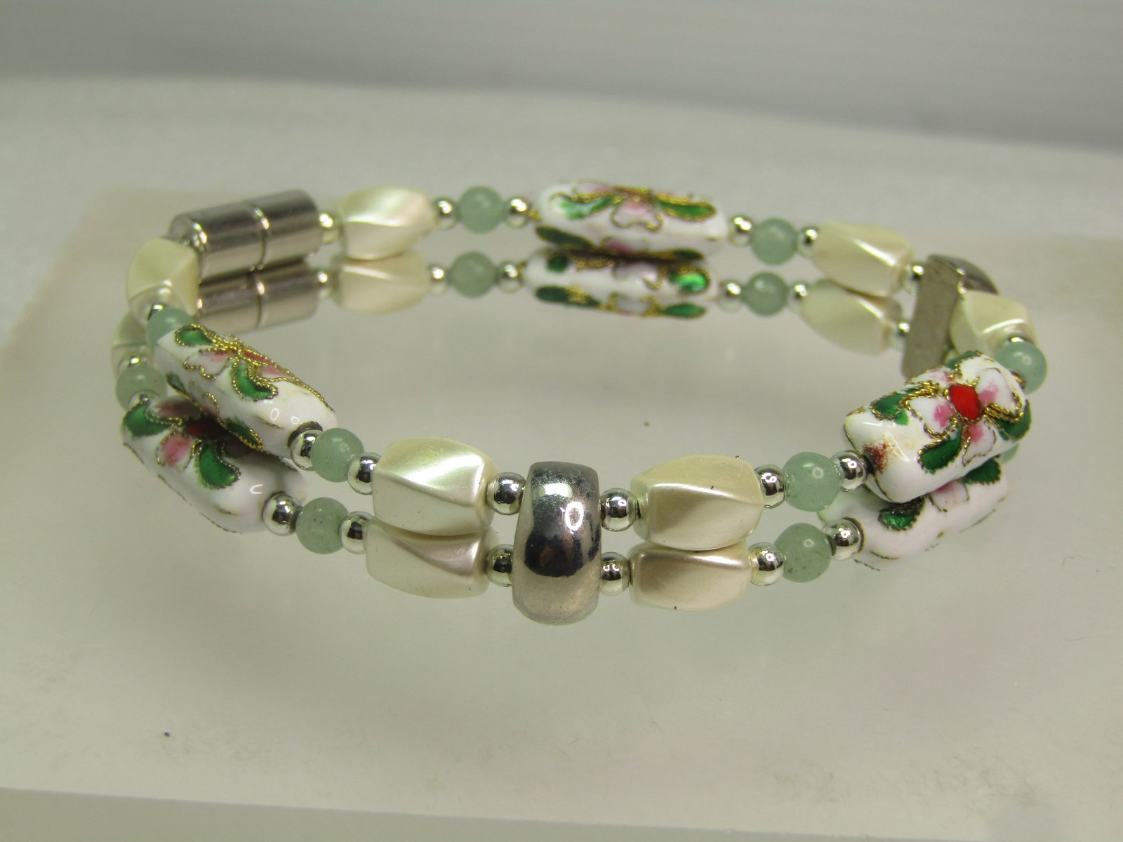 Vintage Cloisonne Double Strand Bracelet, Mixed Beads, 6.5", 1980's: Vintage Cloisonne Double Strand Bracelet, Mixed Beads, 6.5", 1980's Magnetic clasp. Silver tone accent dividers and magnetic clasp with six oblong cloisonne floral beads and faux pearl angled beads