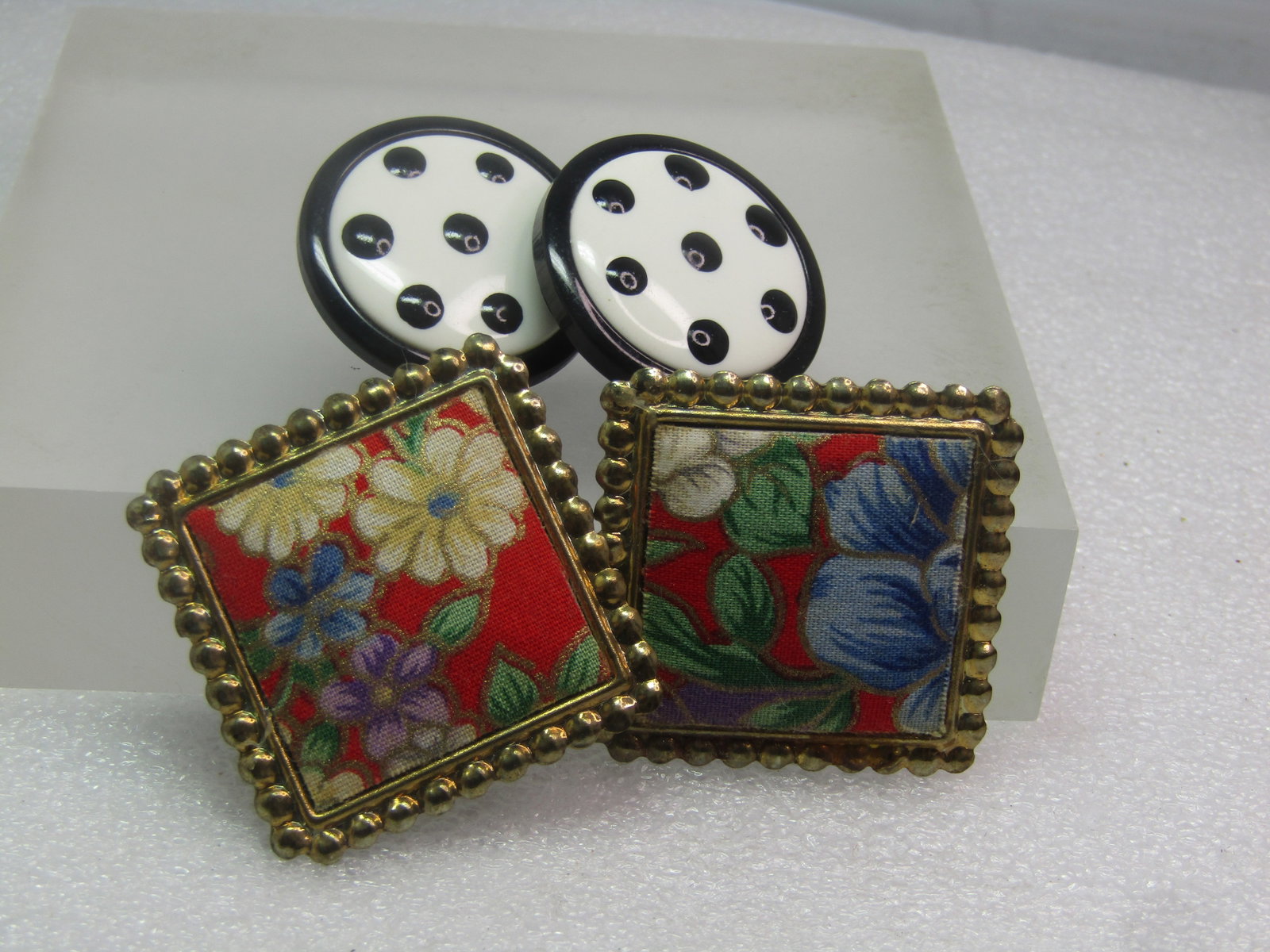 Vintage Two Pair of 1980's Earrings, Floral/Dotted, Pierced: Vintage Two Pair of 1980's Earrings, Floral/Dotted, Pierced. The first paire is a slightly puffy red/blue/green/white fabric floral design with gold tone frame. They are appx. 1.5" across. The other p