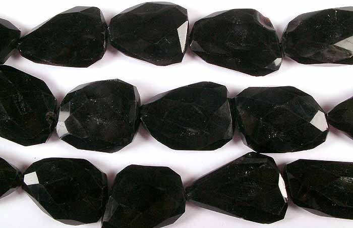 Black Onyx Faceted Flat Tumbles / Gemstone Beads: Title: Black Onyx Faceted Flat Tumbles / Gemstone Beads Description: These Black Onyx Faceted Flat Tumbles exude unparalleled elegance and timeless beauty. With their sleek, polished surface and facet