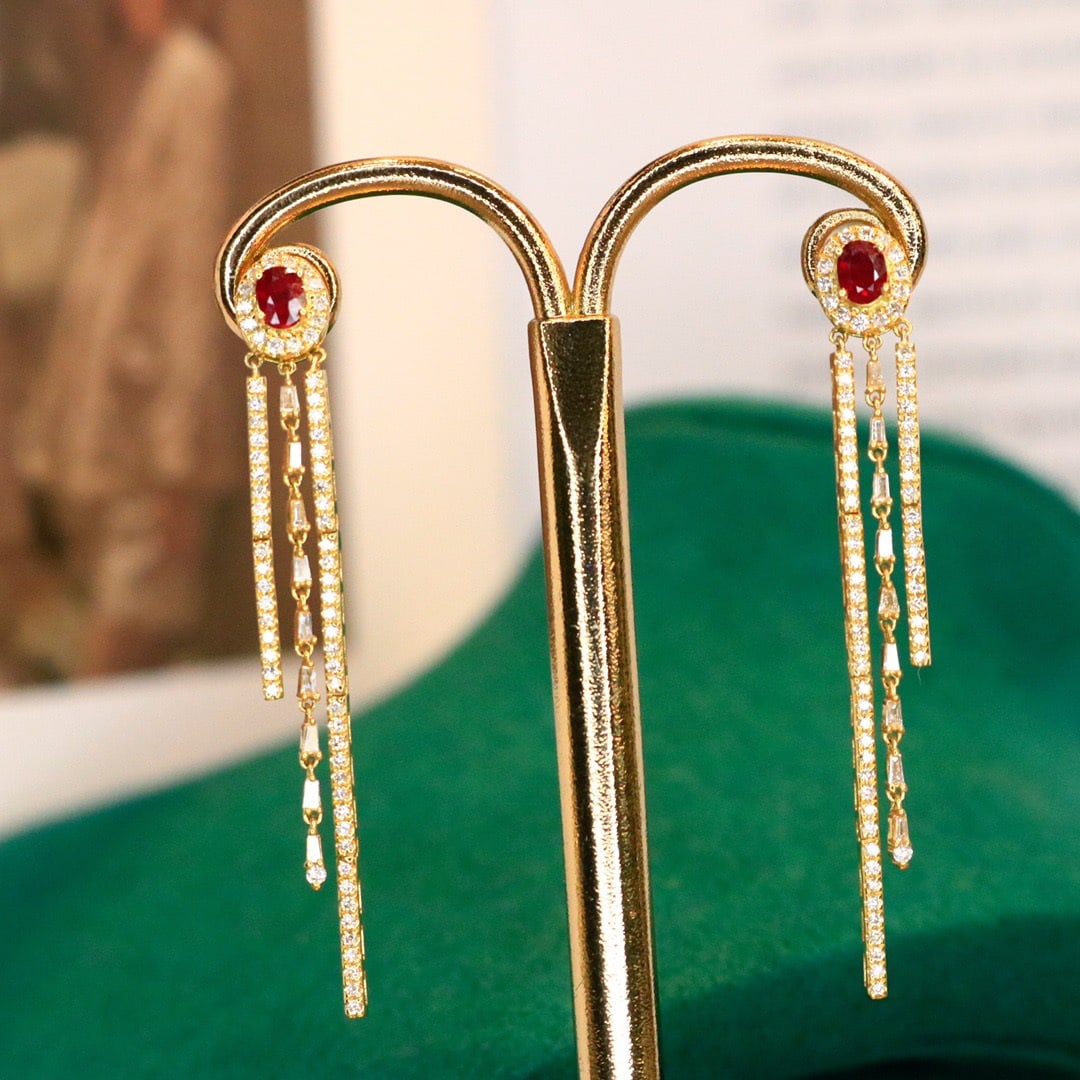 14K GOLD 1.12 CTW VIVID RED NATURAL RUBY and DIAMOND EARRINGS: Title:14K GOLD 1.12 CTW VIVID RED NATURAL RUBY and DIAMOND EARRINGS Description:Ref:230678222Gold Content:14K GoldMain Gemstone:RubyNumber of stones:2Shape:OvalCarat Weight:0.70ct Color:Vivid RedTreat