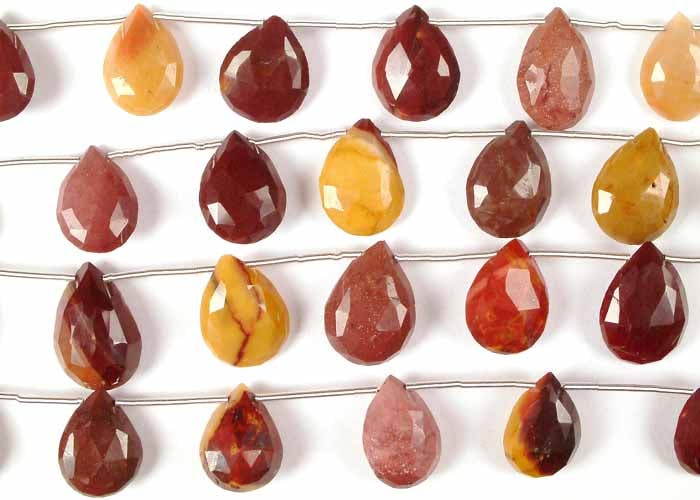 Mokite Faceted Briolette Beads / Gemstone Beads: Title: Mokite Faceted Briolette Beads / Gemstone Beads Description: Drape yourself in the vibrant tapestry of the Australian landscape with these Mookaite Faceted Briolette beads. Each bead is a