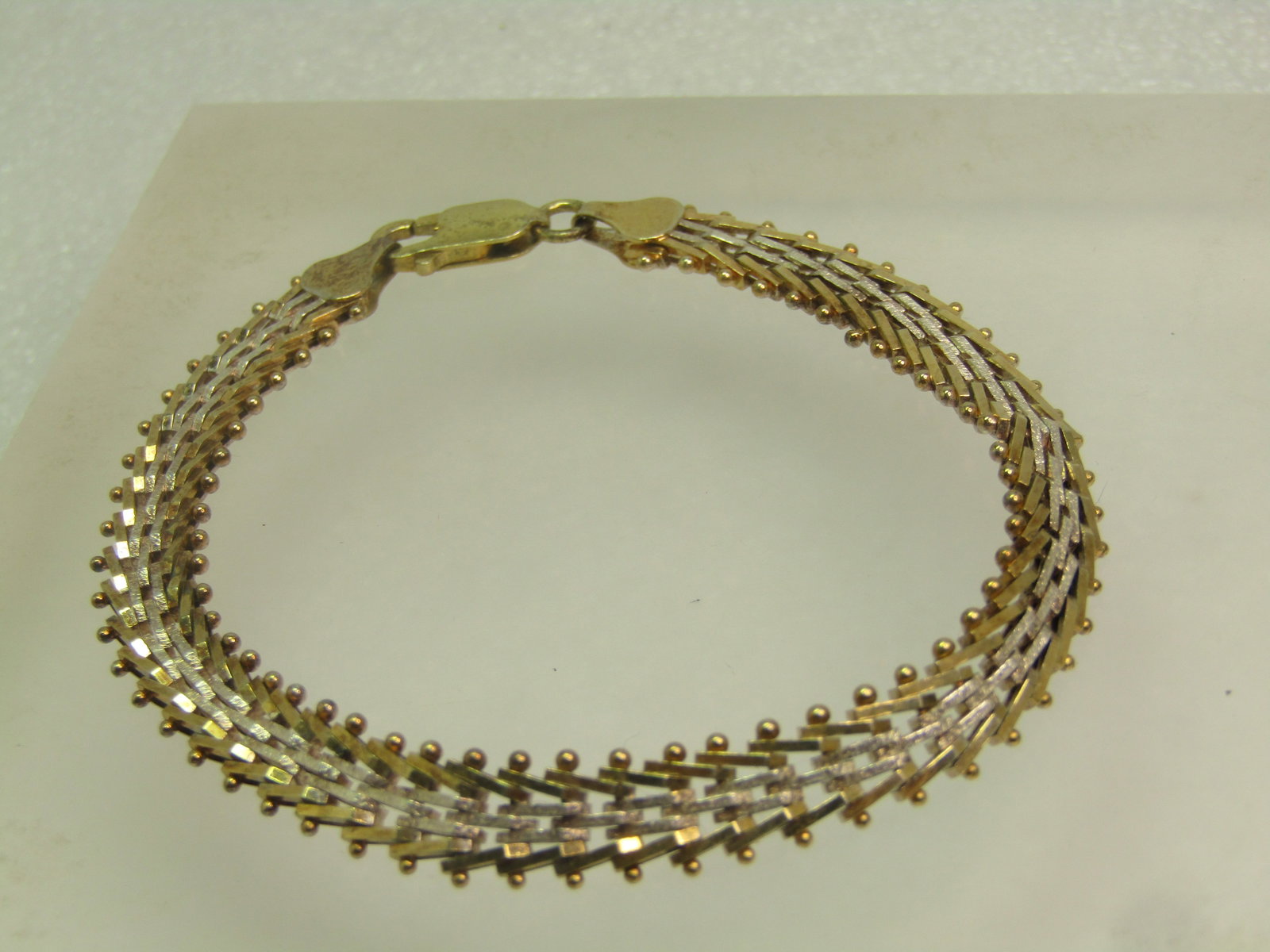 Vintage Sterling Vermeil Woven Bracelet, 8", 1980's-1990's, Two-Tone: Vintage Sterling Vermeil Woven Bracelet, 8", 1980's-1990's, Two-Tone. It is appx. 8mm wide. This is silver and gold tone - one side is all silver tone and the end pieces and clasp are gold over sterli