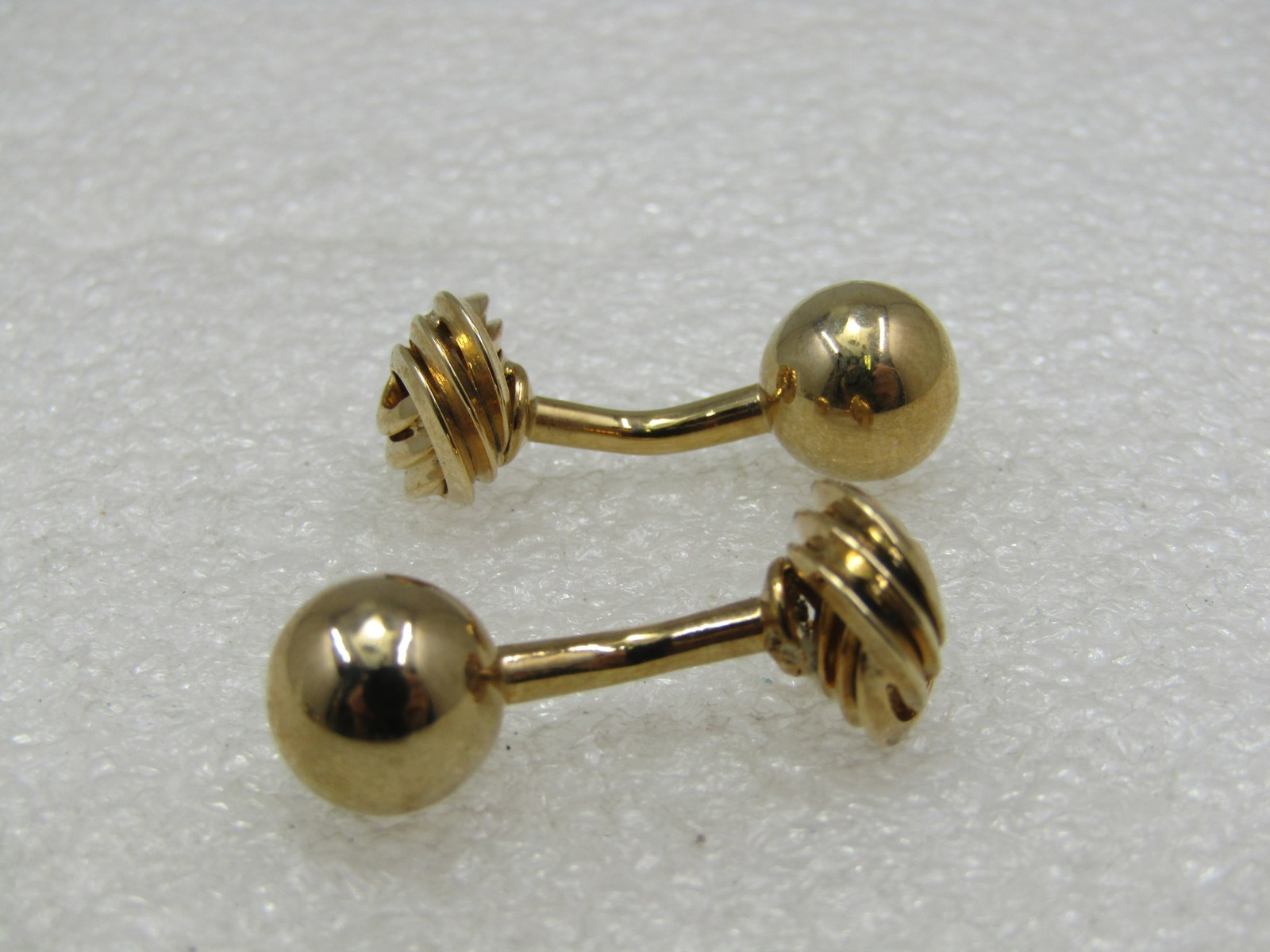 Vintage Love Knot Cufflinks, Tuxedo Style, 1": Vintage Love Knot Cufflinks, Tuxedo Style, 1". They have an appx. 10mm love knot on one end, a slight curve and a 9mm ball on the other. They are not marked or signed - acid tested - 10kt gold filled